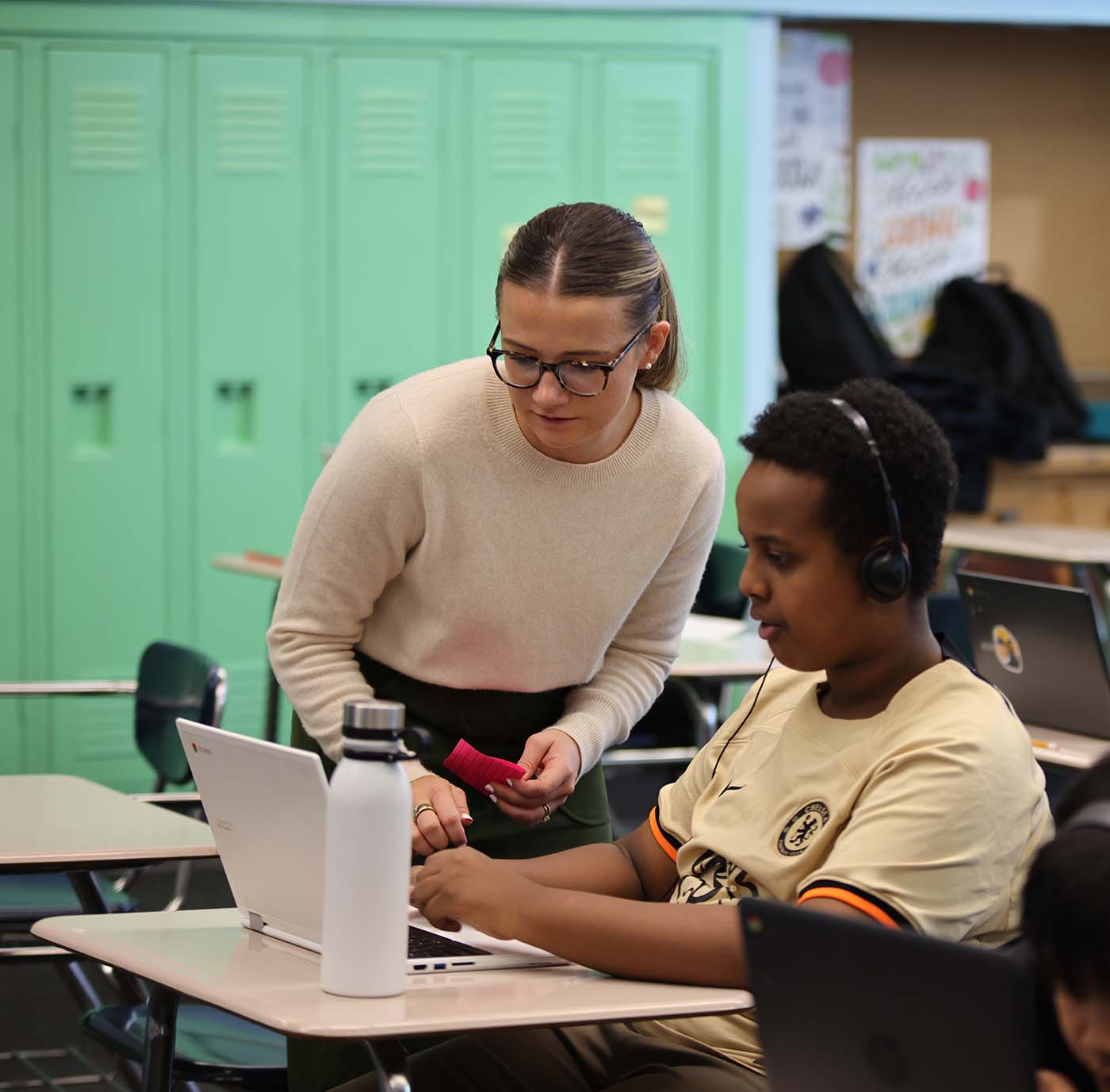 HSA Twin Cities student drawing at a desk in a classroom setting